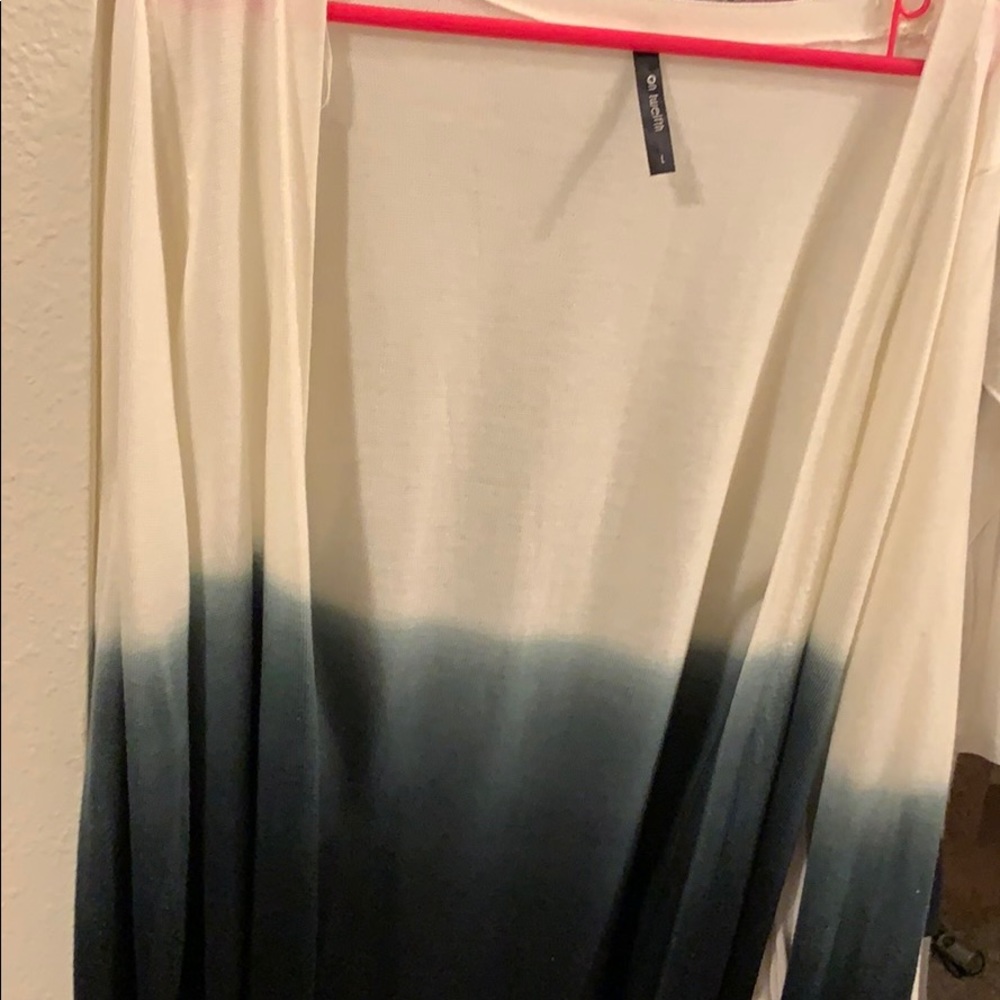 On twelfth white to blue ombré sweater